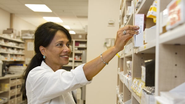 Pharmacist selecting a medicine box